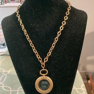 Gold tone magnifier on 16 inch chain necklace